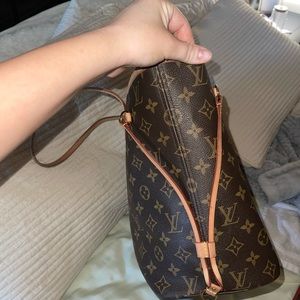 Lightly used Louis Vuitton Neverfull bag. Red interior with the brown monogram.